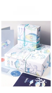 Detail showing high-quality watercolor ocean theme gift wrapping paper with coral patterns