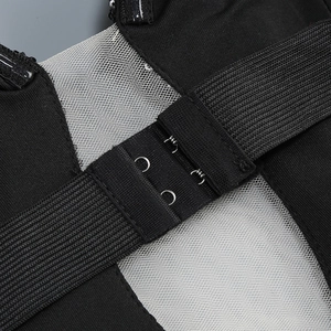 Detail of the back double-row hook closure and breathable mesh on black sequin dress