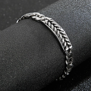 Punk style men's silver stainless steel bracelet featuring a woven wheat pattern design