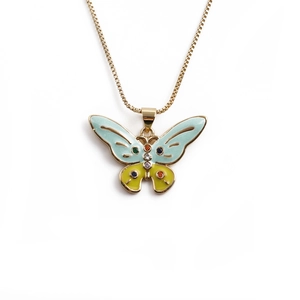 Golden butterfly pendant necklace with colorful enamel and inset gemstones on white backdrop