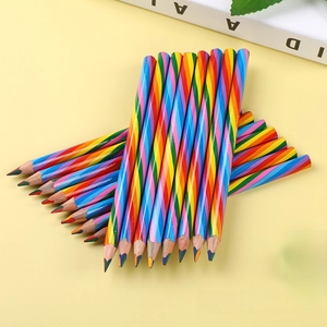 Close-up of wooden rainbow pencils with spiral stripes and a green sharpener detail