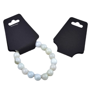 Green jade bead bracelet displayed on black card packaging against white background
