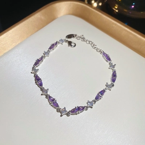 Detail of silver bracelet with purple marquise zircon and adjustable lobster clasp