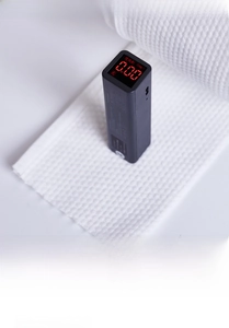 Detail of waffle texture face towel with fluo-test showing zero fluorescent agent safety