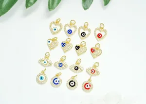 Detail of 18K gold plated evil eye charms with micro-pave zircons and colorful enamel