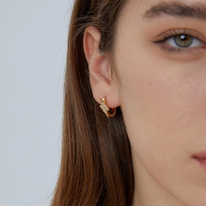 Minimalist gold lightning bolt hoop earrings with zircon pavé stones for women