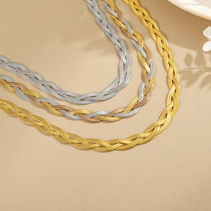 Handwoven titanium steel snake bone necklaces in gold, silver, and tricolor finishes