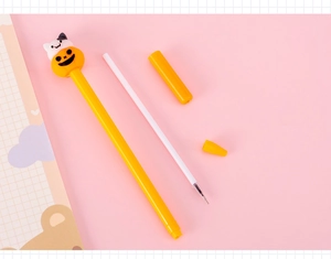 Close-up of Halloween pumpkin cat pen with replaceable ink refill and yellow cap