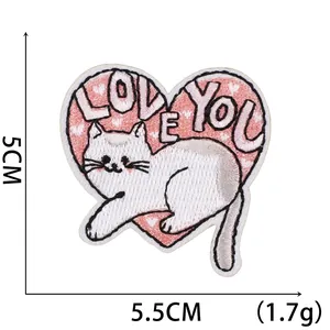 Detail showing heart-shaped cat embroidery patch with LOVE YOU text and dimensions