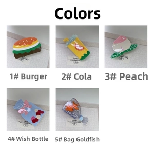 Detailed set of cute acetate hair claws in burger, fruit, and wishing bottle shapes
