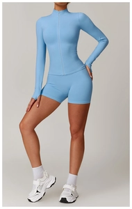 Detail of light blue seamless yoga jacket with zipper collar and ribbing texture