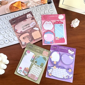 Flat lay of four colorful cartoon sticky note sets on a desk with a white keyboard