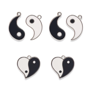 Yin Yang jewelry pendants with black and white enamel finish on a clean white background