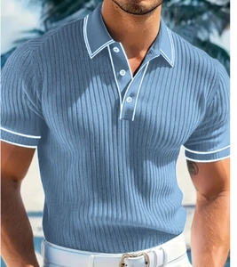 Detail of light blue short sleeve polo shirt with white contrast stripes on collar and cuffs