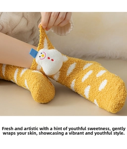 Detail of yellow striped coral fleece sock with a 3D snowman patch for winter warmth