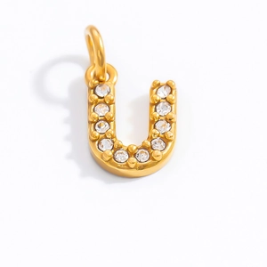 Macro shot of 18K gold plated letter U pendant with shimmering pavé crystal detail