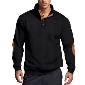 Detailed view of jacquard texture, button collar and brown elbow patches on men's sweater