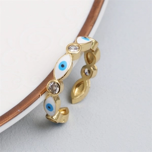 Detail of adjustable evil eye ring with blue enamel and sparkling cubic zirconia stones