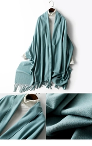 Detailed view of the soft knitted cyan shawl wrap with stylish tassel hem decoration