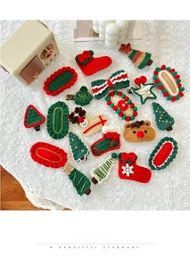 Detailed close-up of 18-piece handmade crochet Christmas hair clips with festive motifs