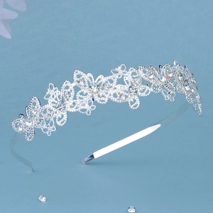Detailed view of silver butterfly crown headband with shimmering crystals for girls