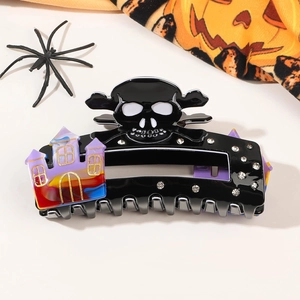 Detailed Halloween hair claw featuring skull crossbones and a colorful castle design
