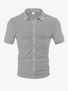 Detail of grey men's short sleeve shirt showing herringbone texture fabric and size label