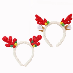 Christmas reindeer antler headband set with red sequins and festive holly leaf decorations
