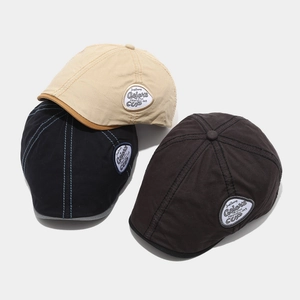 Three retro newsboy caps in khaki, black and brown cotton canvas with brand embroidery