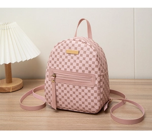Pink lychee texture backpack with brown geometric dots and golden zipper detail