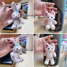 Detail of plush StellaLou and LinaBell keychains with metallic ring and soft fur texture