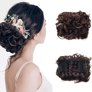 Detail of dark brown wavy synthetic hair bun showing side combs and mesh structure