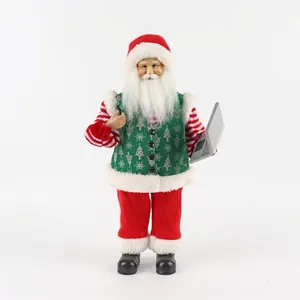 Detail of Christmas Santa plush doll holding a laptop model with festive fabric outfit