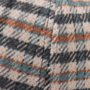 Detailed macro shot of thick houndstooth fabric with premium stitching on baseball cap
