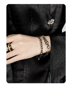 Detailed shot of s925 silver double-layer chain bracelet and irregular ring on hand