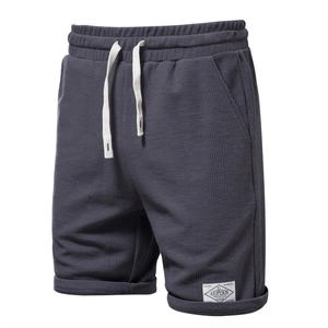 Men's dark grey waffle knit shorts with elastic drawstring waist in a relaxed fit