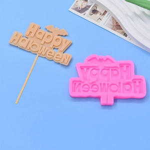 Macro shot of Happy Halloween silicone mold with bat design for cake fondant DIY