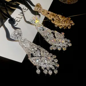 Luxe rhinestone necktie fringe necklace with sparkling crystals in gold and silver finish