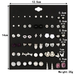 Detailed view of alloy stud earrings set with pearl, flower, and heart motifs and dimensions