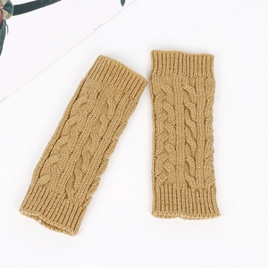 Detailed view of cable knit pattern on camel acrylic yarn fingerless arm warmers