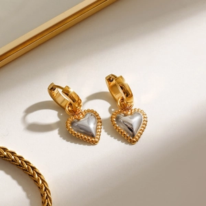 Two-tone 18k gold and silver heart drop earrings with textured threaded border