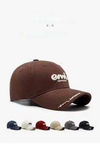 Detail view of cotton baseball cap showing 3D white embroidery and multiple color options