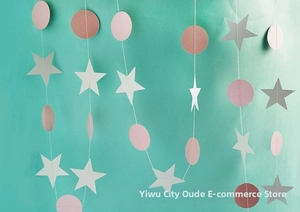 Detail of pink and grey paper star and circle garland for birthday party decoration