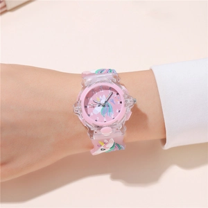 Detail view of pink unicorn kids watch with luminous LED dial and 3D silicone strap