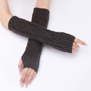 Detail of dark brown cable-knit arm warmers with thumb holes and diamond pattern