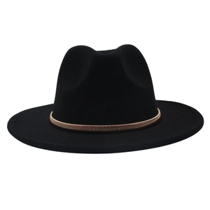 Detail of black fedora hat featuring a textured gold metal ring and wide flat brim