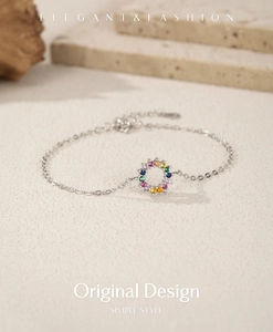 Detail of S925 sterling silver chain featuring a circular rainbow gemstone pendant