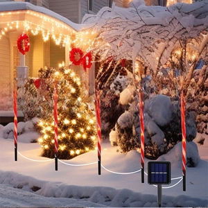 Solar Christmas candy cane path lights with Santa Stop Here signs for garden decor
