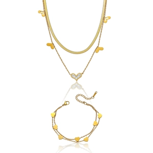 Detail of double-layer stainless steel jewelry set with gold heart and shell pendants
