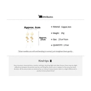 Detailed size specifications of long gold tassel earrings with silver needles and copper